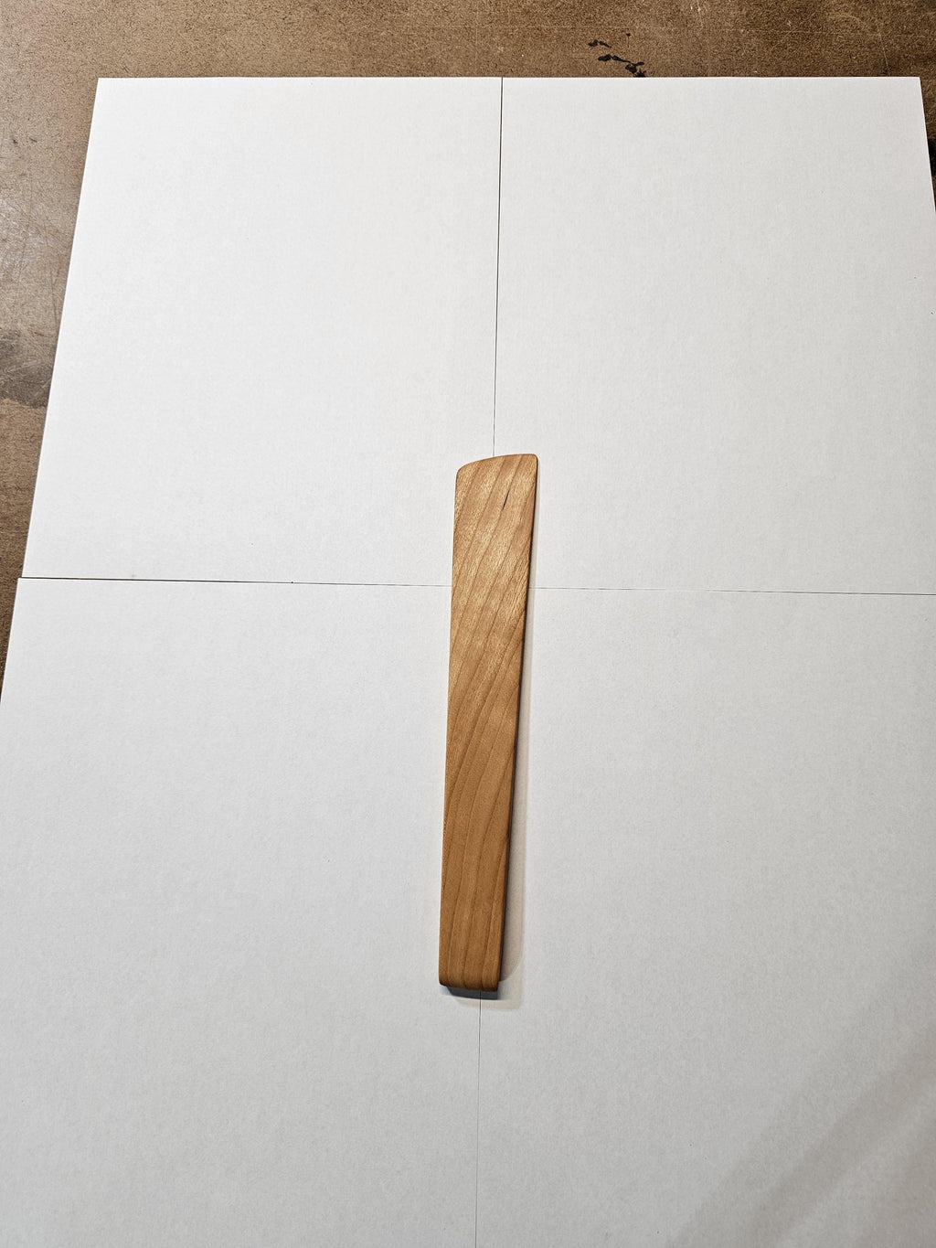 basic wooden stirring spatula on white background