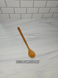 A single wooden spoon with a warm medium-brown finish lies on a white marble-patterned countertop with a white subway tile backsplash. A text overlay at the bottom reads 'DIGITAL DOWNLOAD ONLY'.