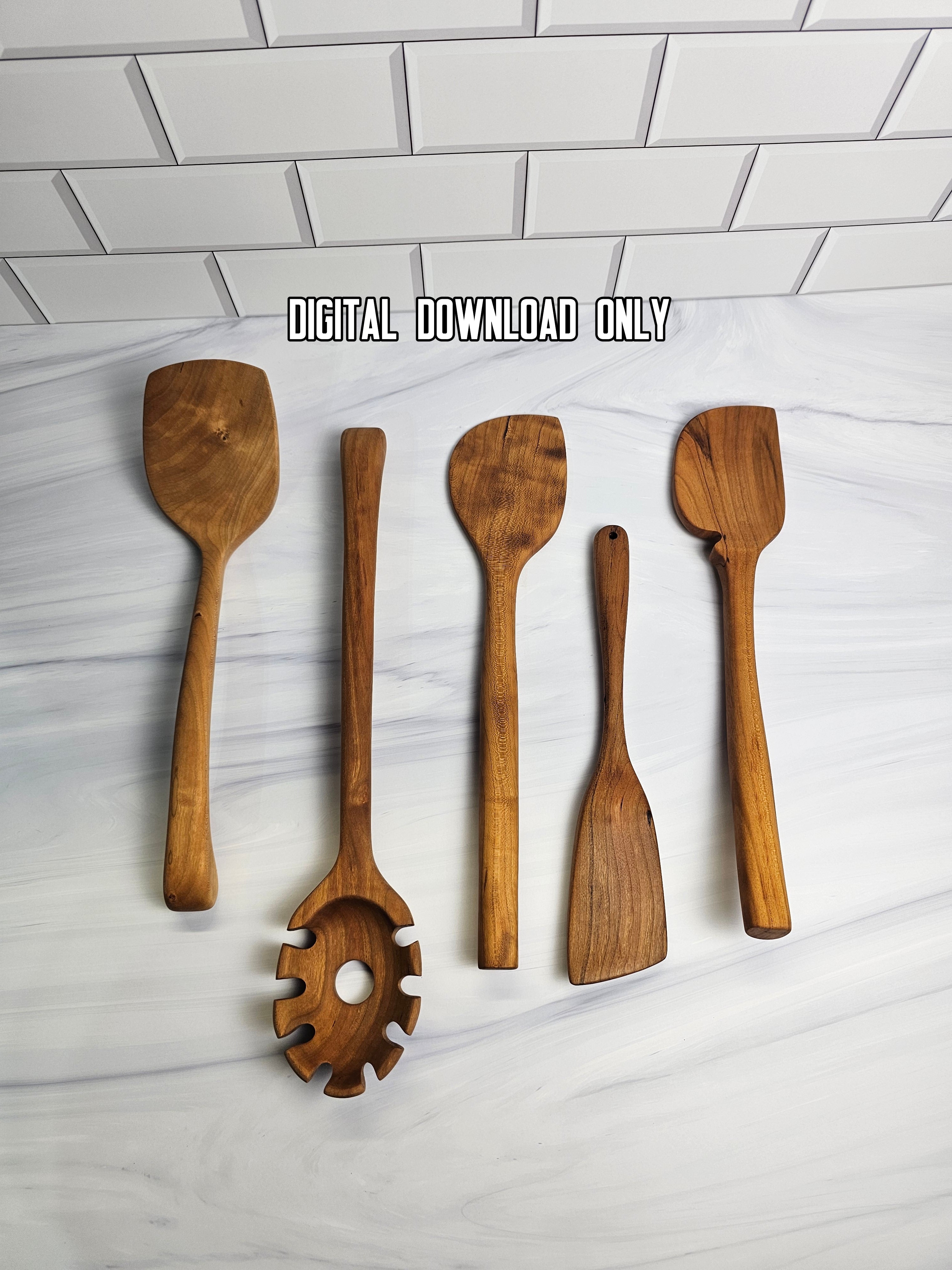 Set of wooden kitchen utensils on a white marble surface with a subway tile background.
